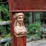 Mahogany pediment mirror with Empire-style cariatids. Return from Egypt