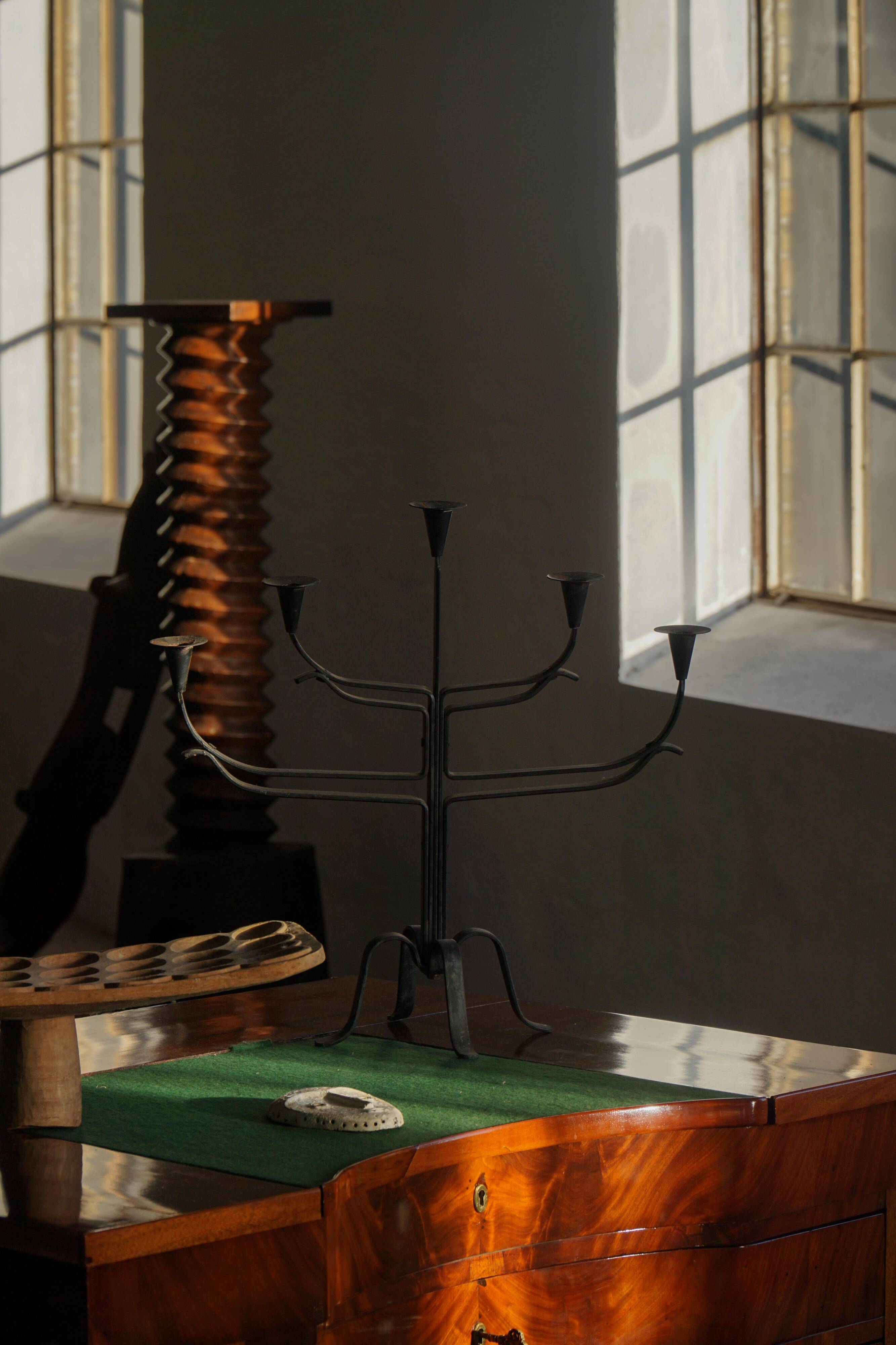 Brutalist Scandinavian candlestick in wrought iron and metal from the mid-20th century.