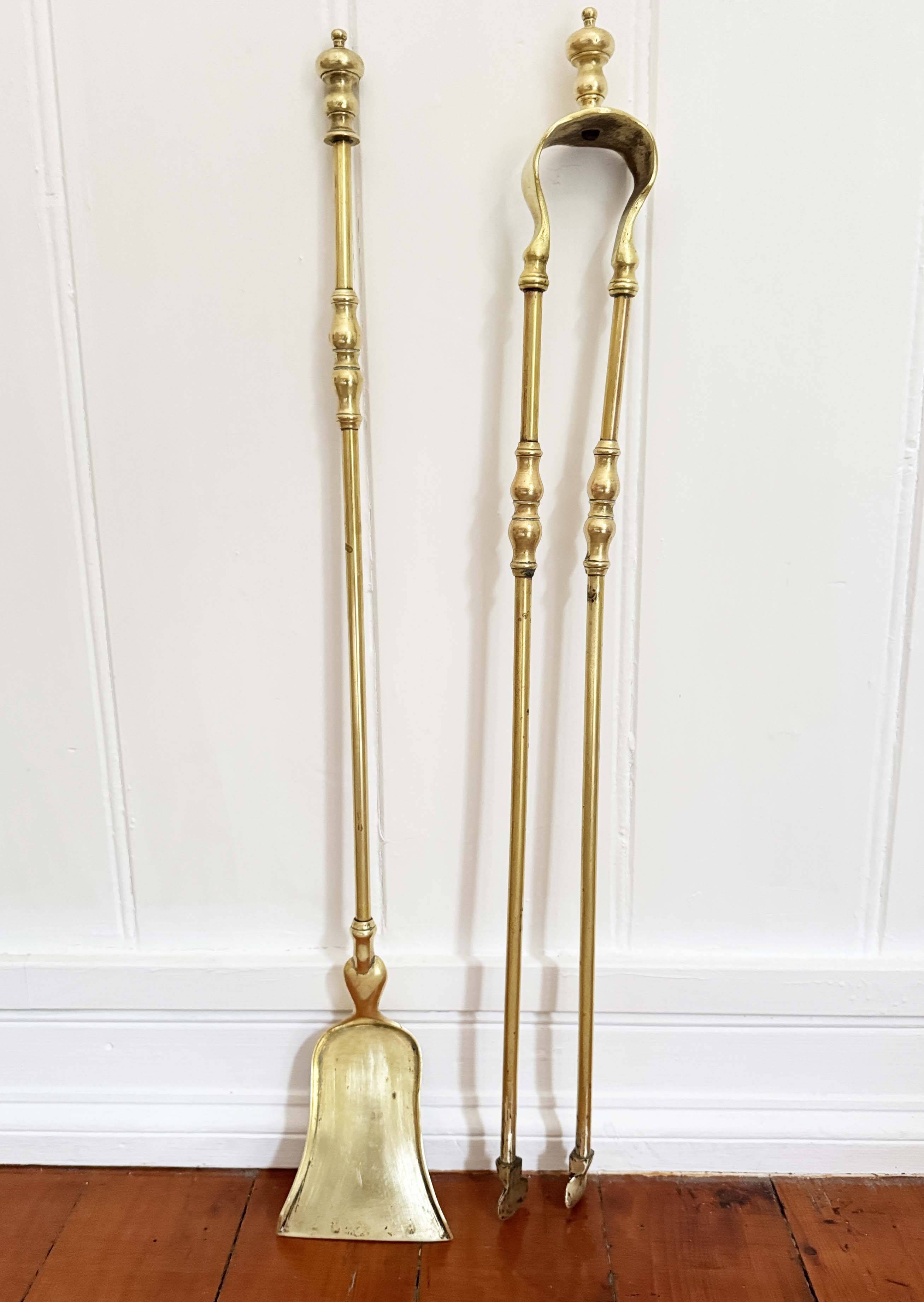 19th-century brass fireplace tongs and shovel.