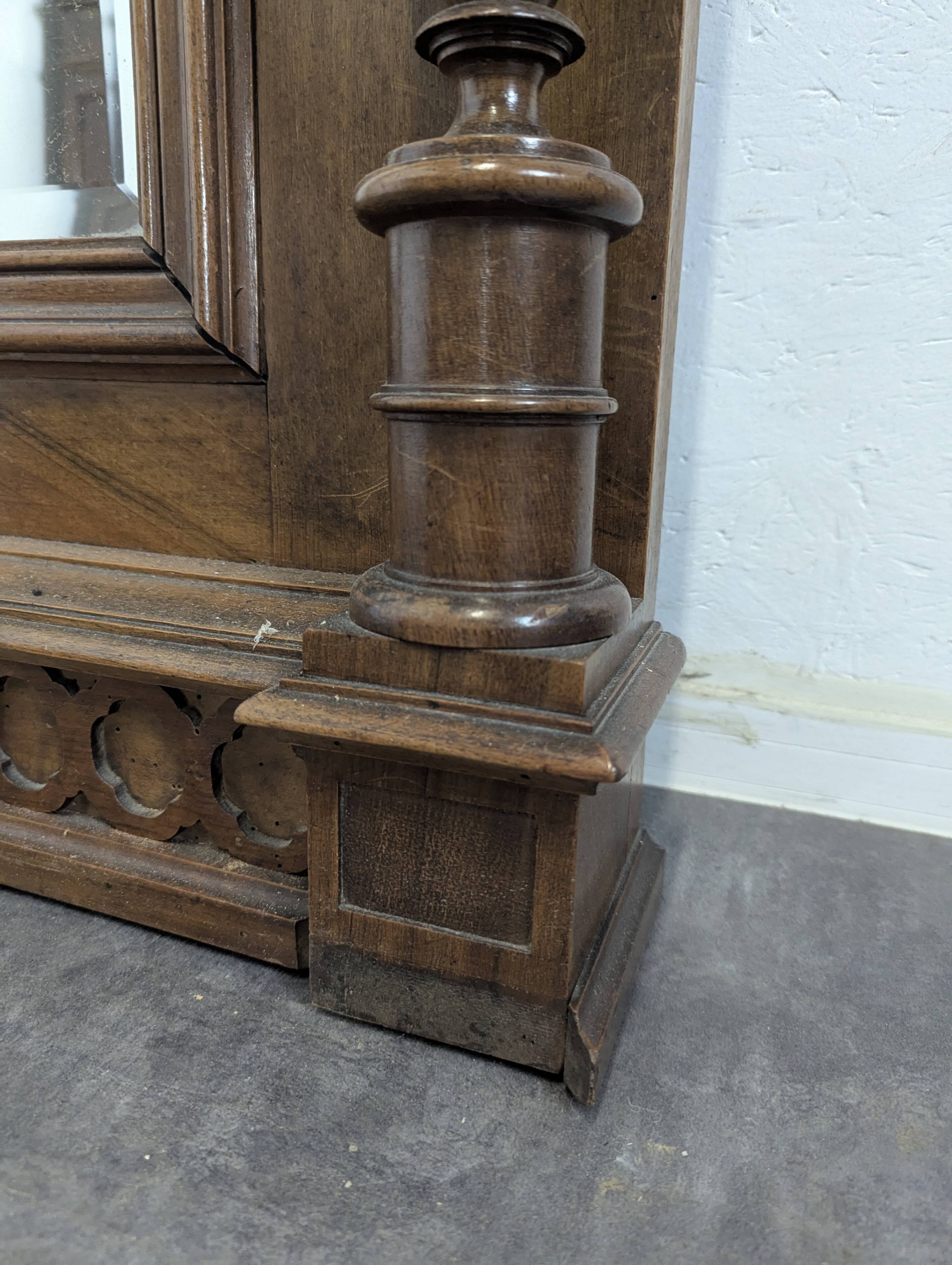 Large Renaissance-style mirror in solid walnut