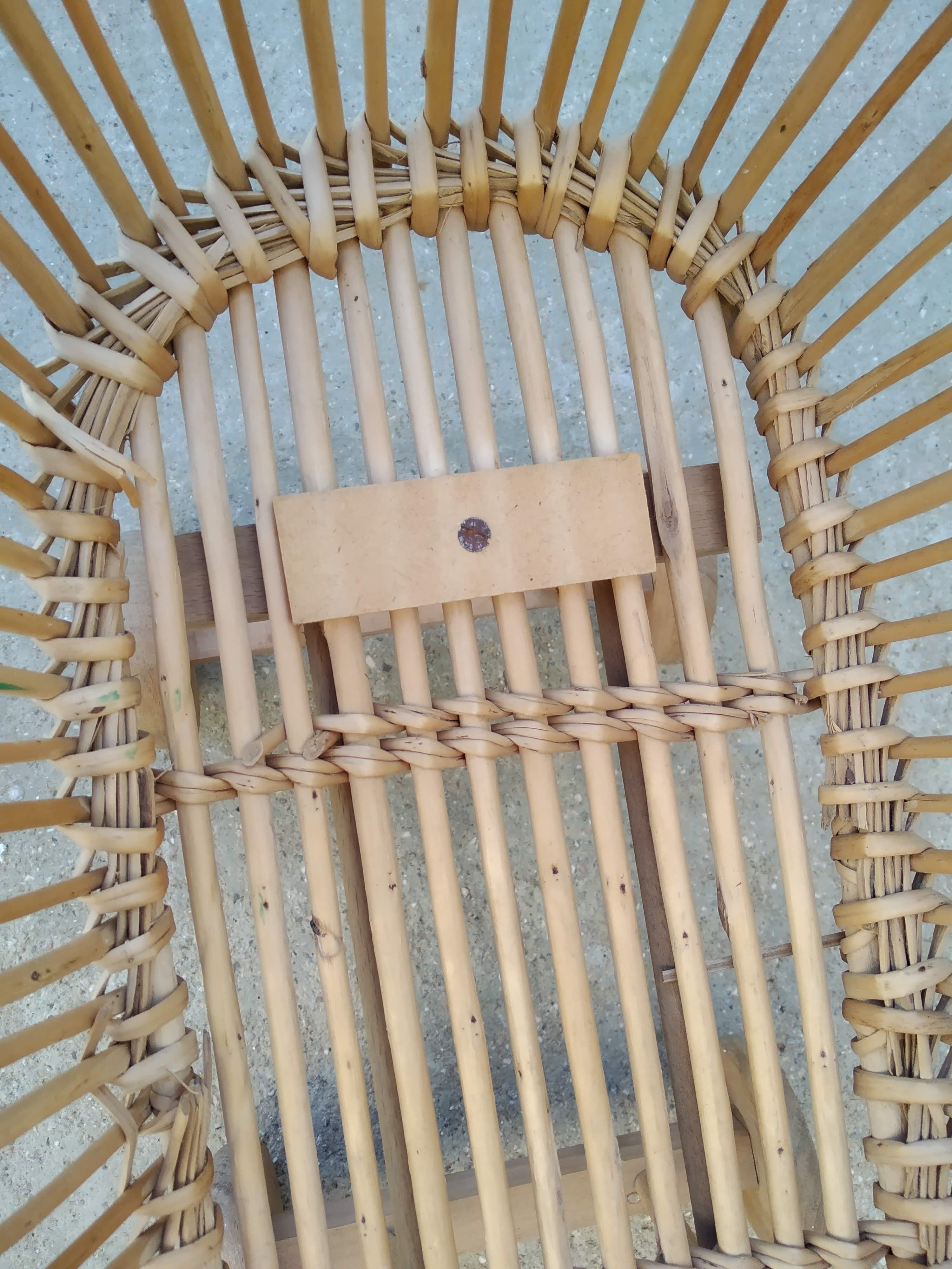Rattan cradle for doll on vintage wheels