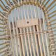 Rattan cradle for doll on vintage wheels