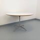 Vintage Eames round table for Vitra in white melamine, wood, and metal.