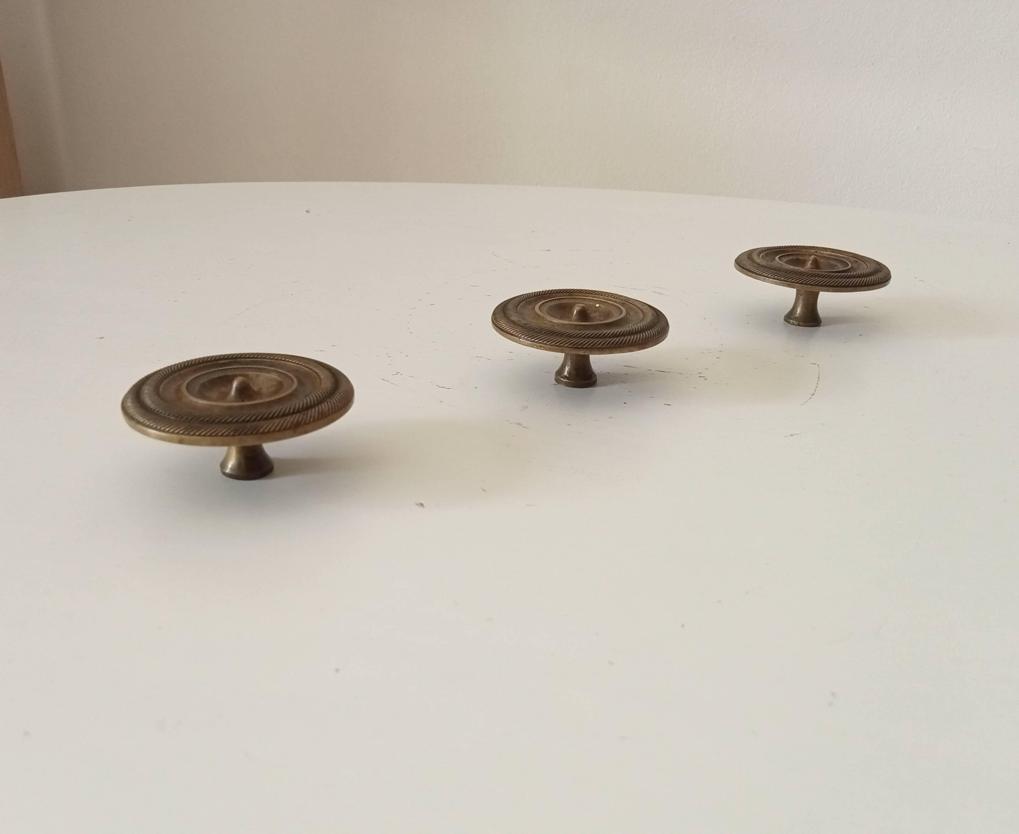 Pair of 19th-century Empire-style solid bronze furniture handles.