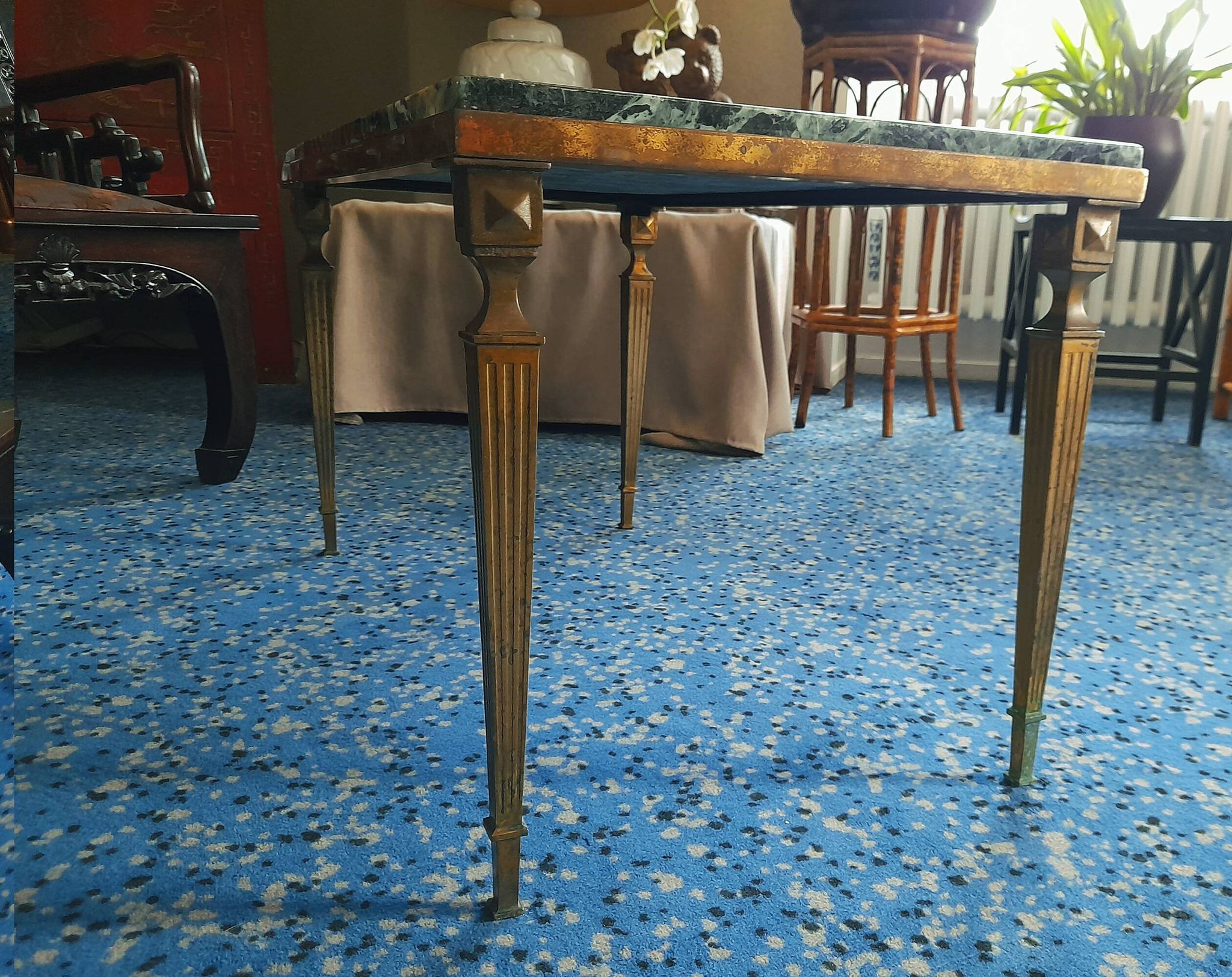 Coffee table in gilded bronze and green Alpine marble