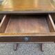 Small drop-leaf side table in English style with leather top & drawer.