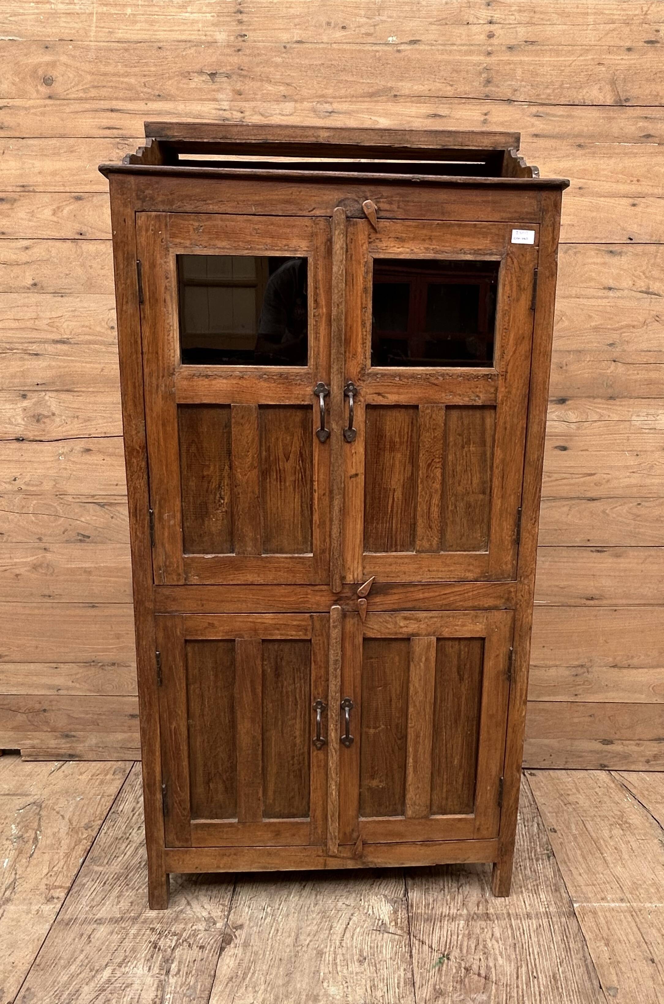 Art Deco glass-fronted cabinet in Burmese teak with original patina.