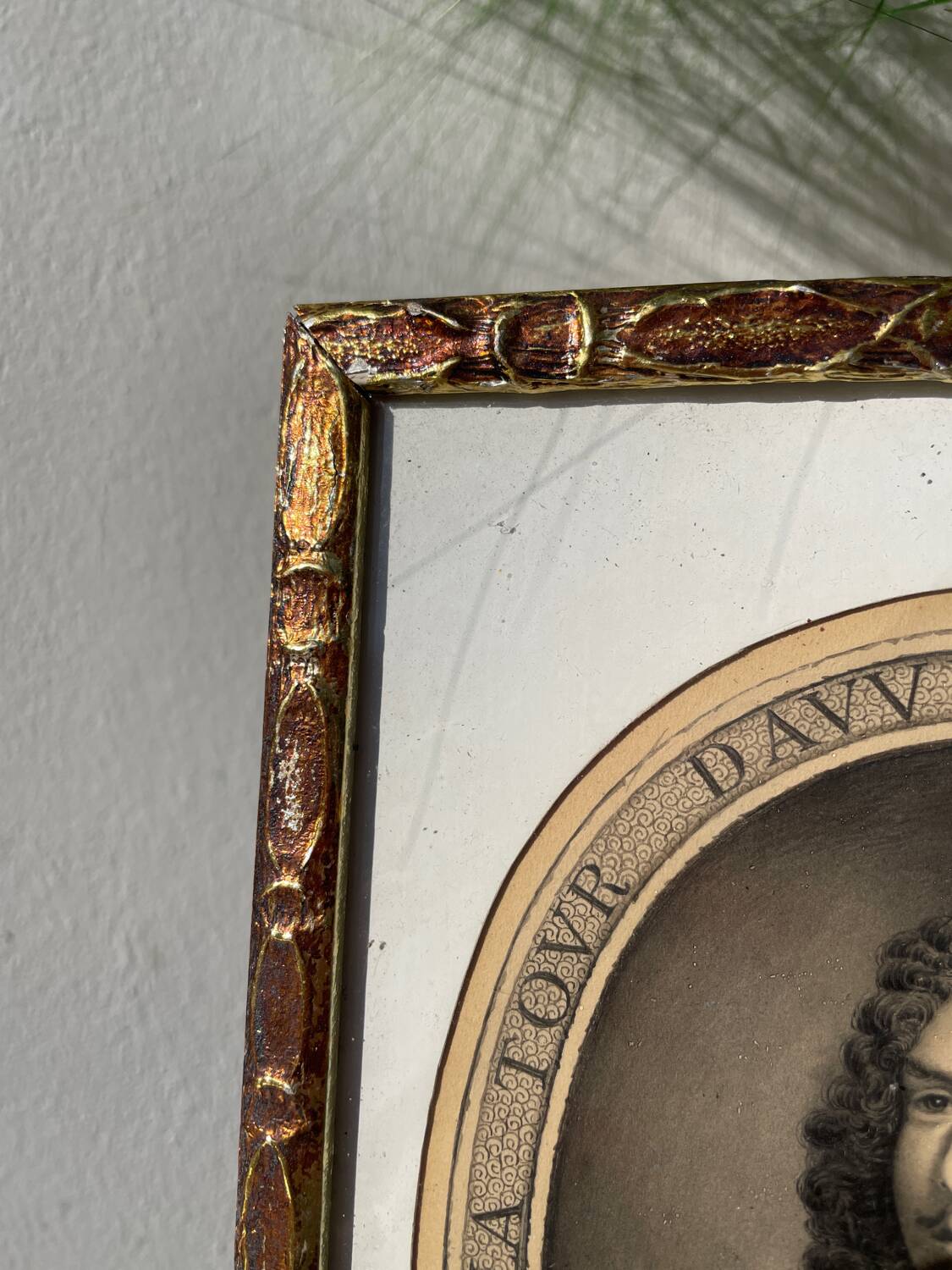 Classic antique man portrait in gilded frame