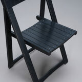Set of three black folding chairs circa 1980