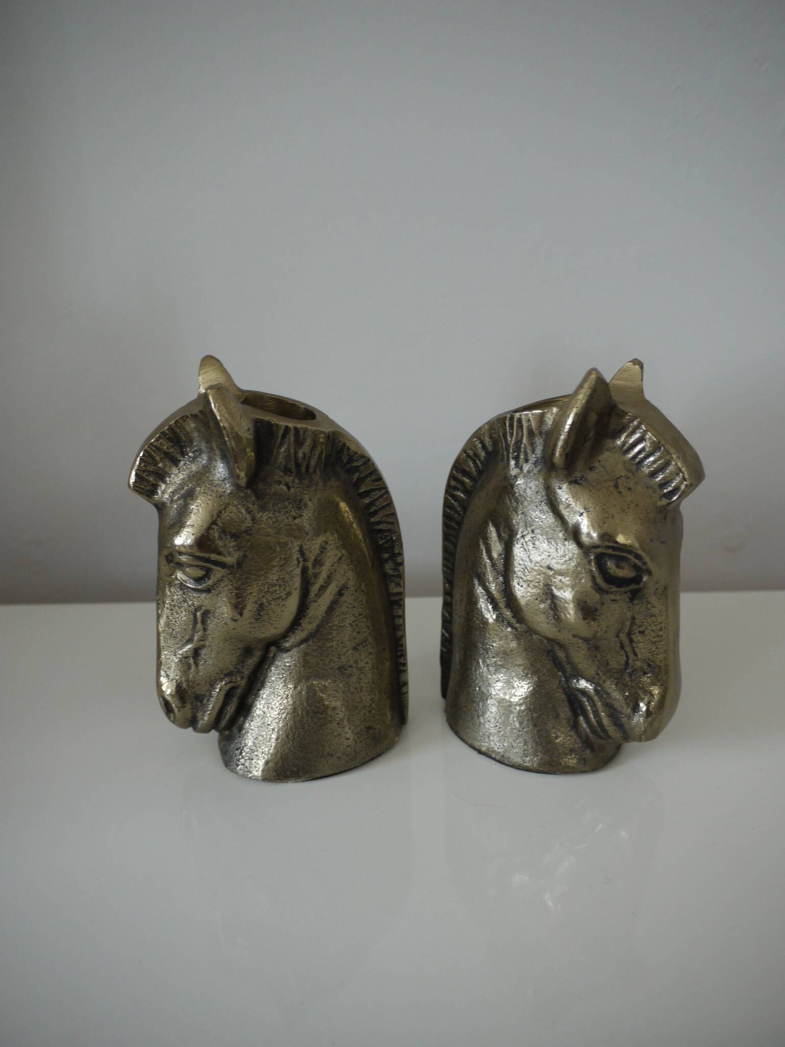 Set of two horse head candle holders.