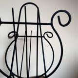 Wrought iron lyre magazine rack from the 50s