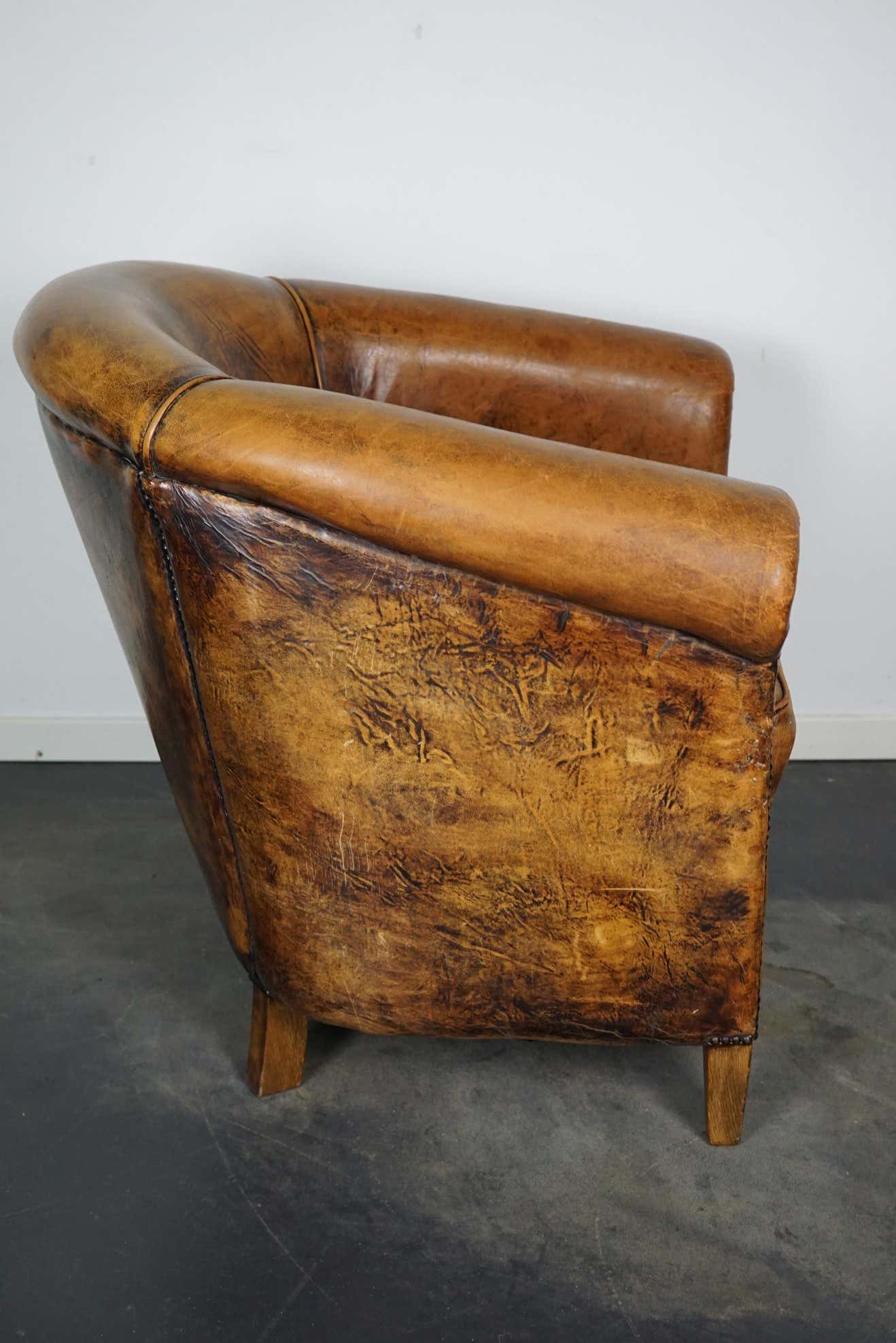 Vintage club armchair in leather color cognac Netherlands