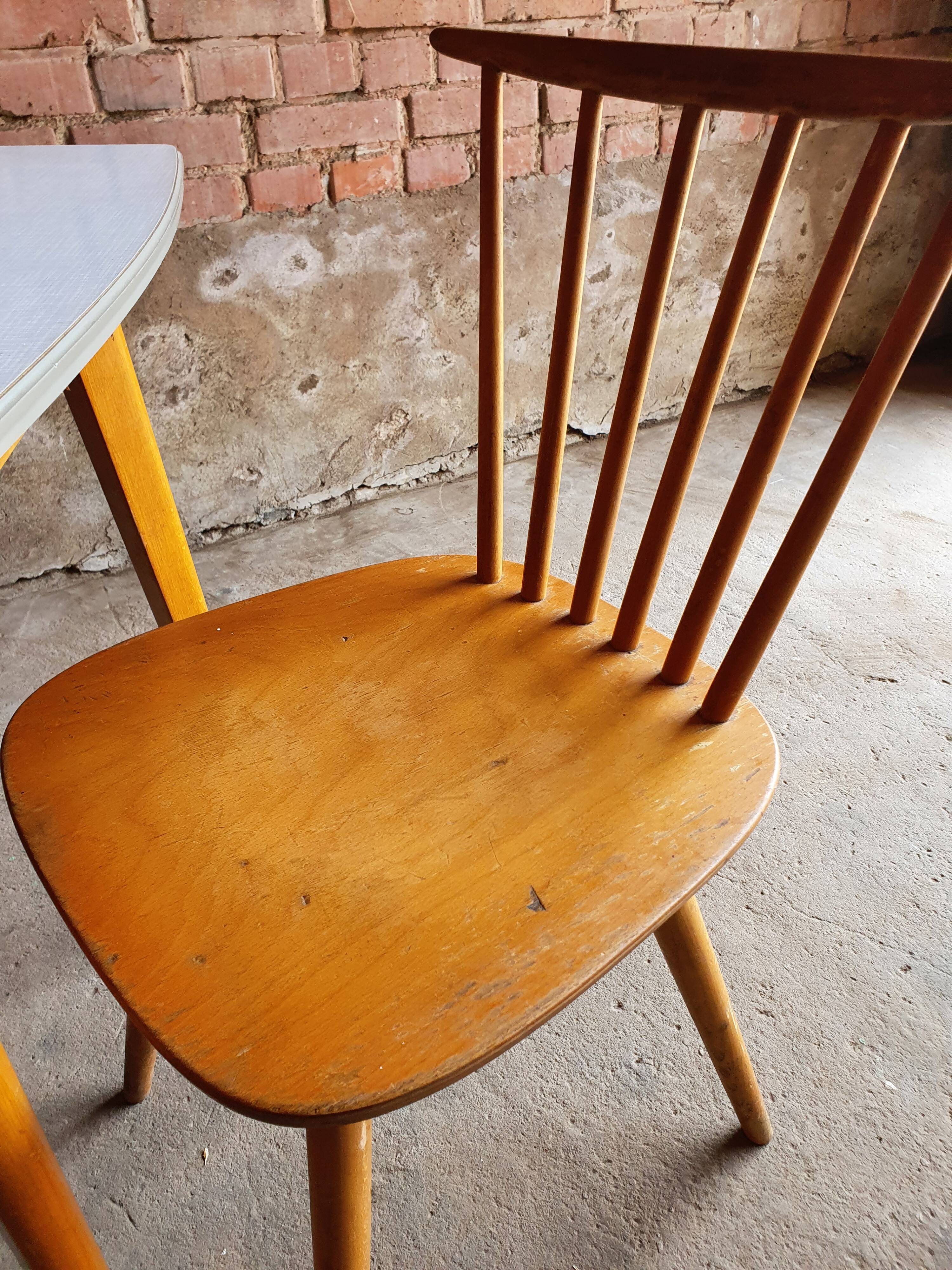 Together two Scandinavian chairs and its wooden and formica table