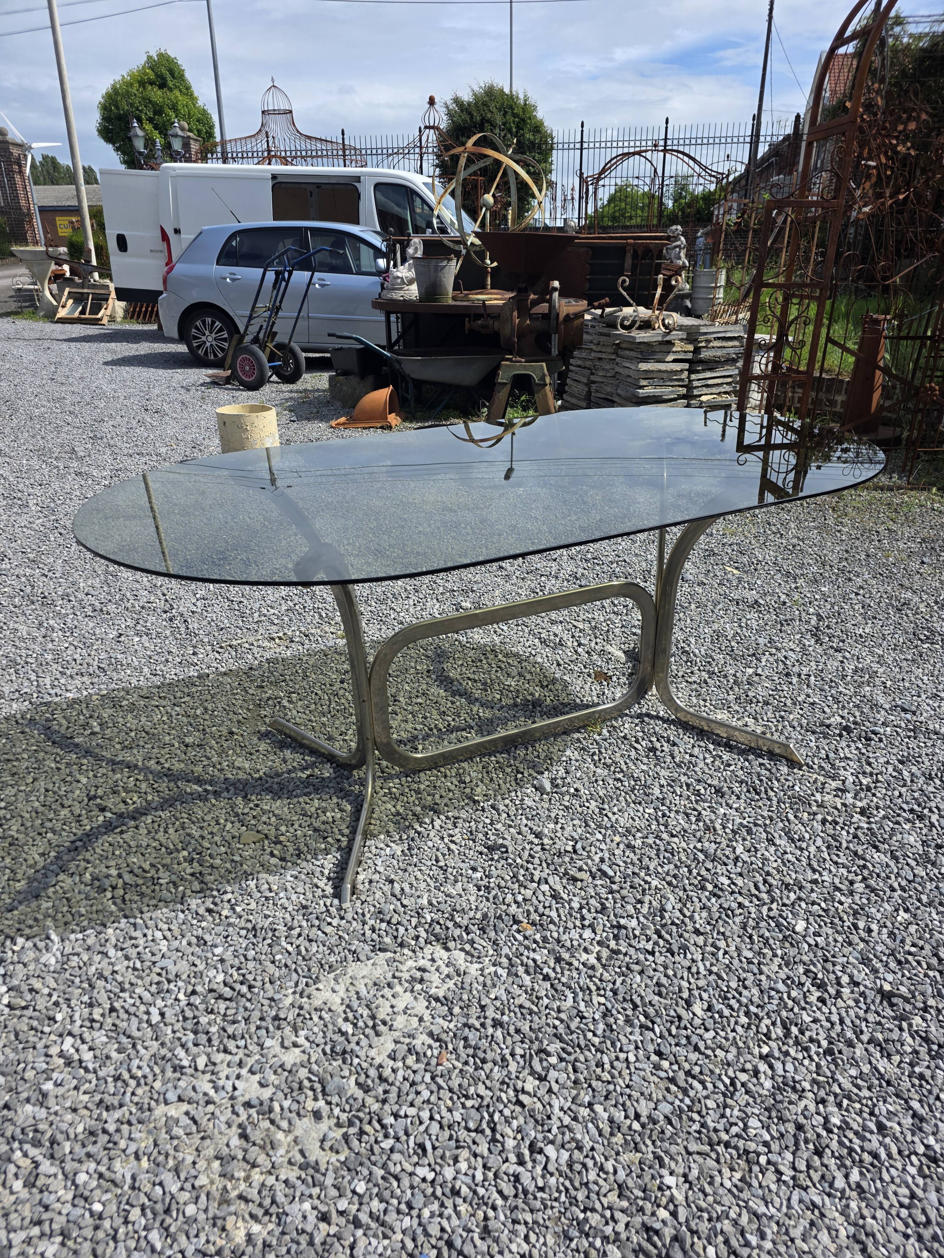Silver metal table with smoked glass top from the 1970s.