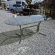 Silver metal table with smoked glass top from the 1970s.
