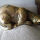 Chat en laiton