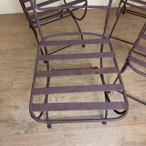 Series of four designer cast iron chairs with reversed backs and very beautiful x-legs