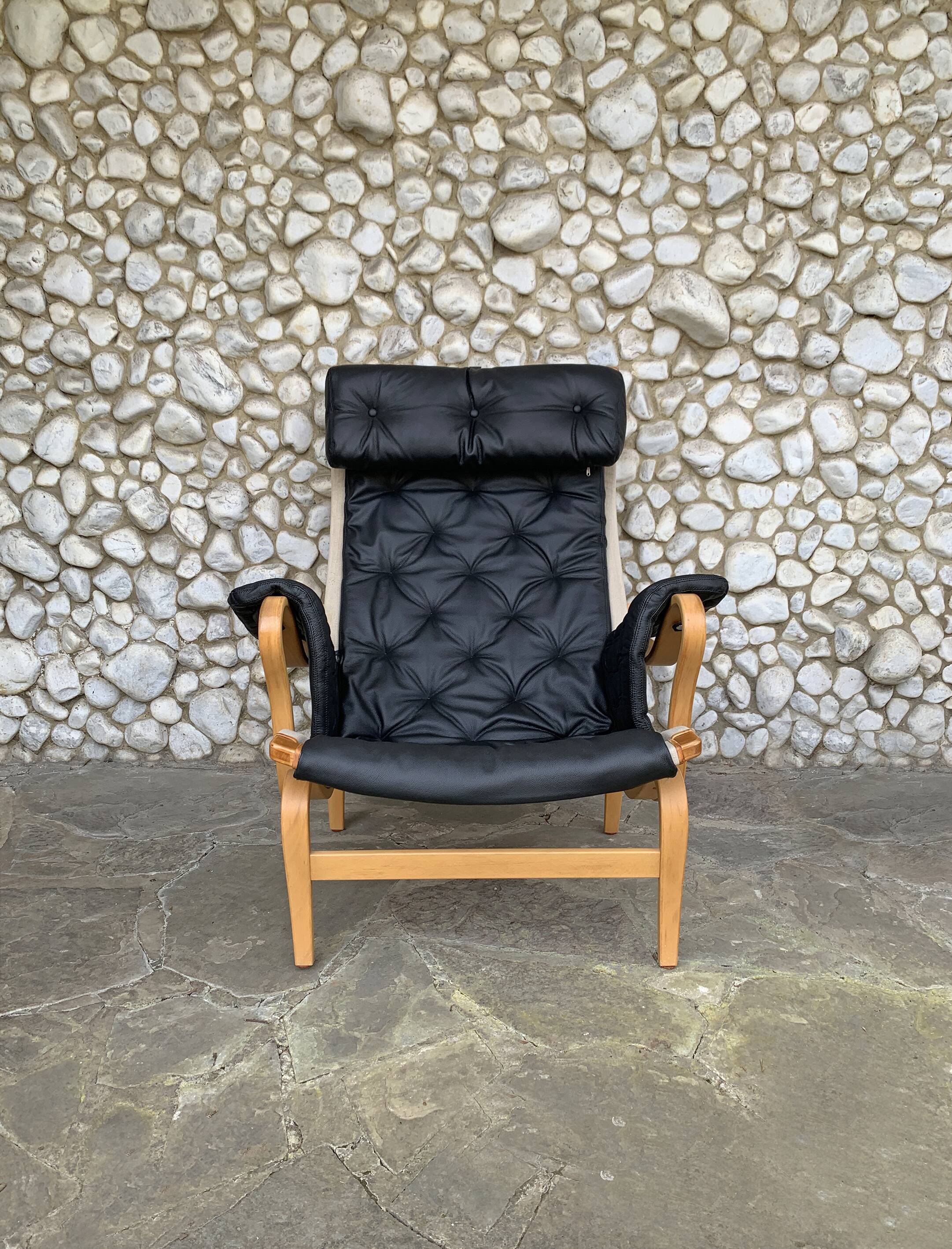 Pernilla armchair new black leather by Bruno Mathsson, Dux, Sweden 1970