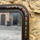 Antique Napoleon III mirror, black frame with hand-painted floral decoration – 19th century