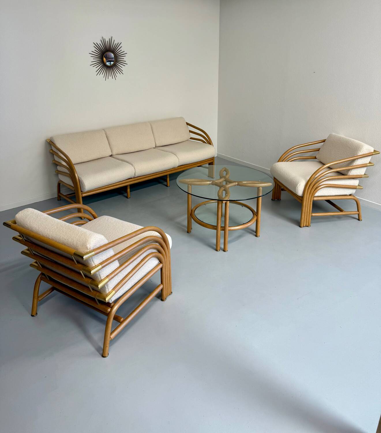 Complete living room with rattan sofa and white bouclette, brass finish, 80's design