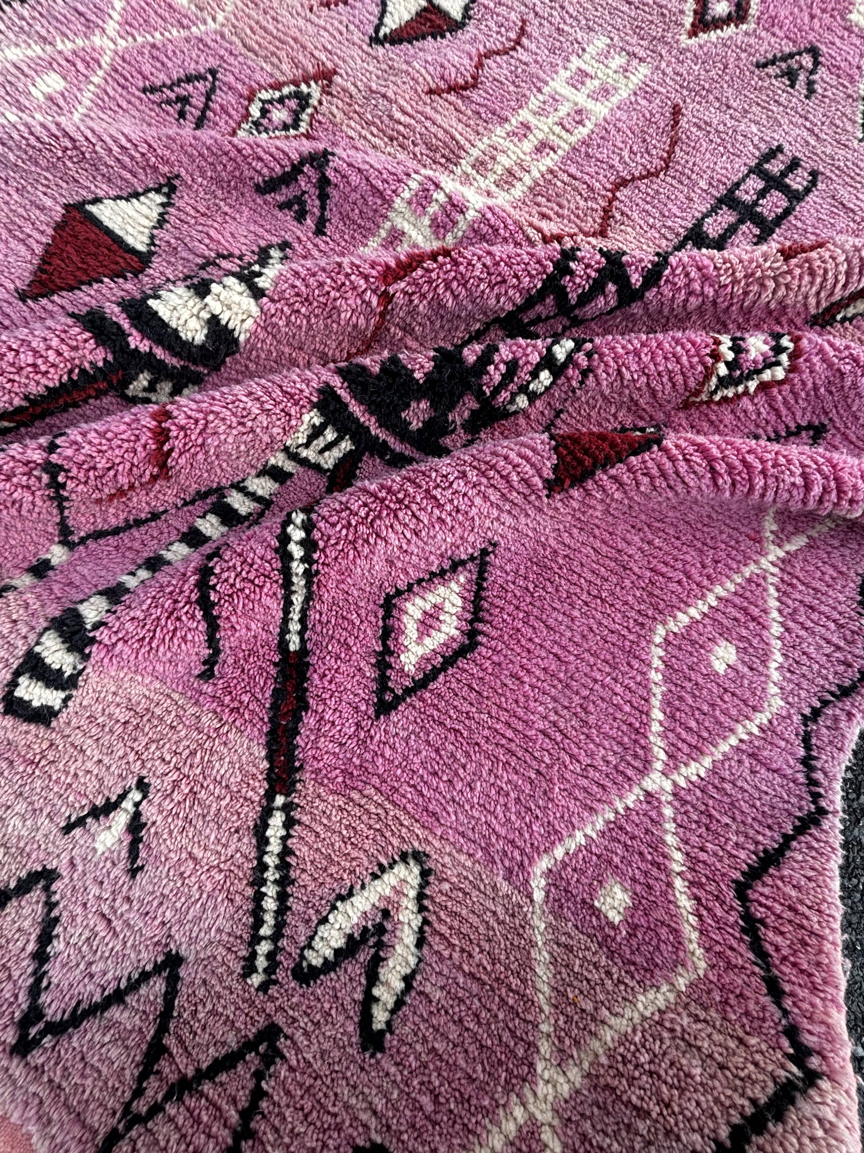 Berber Moroccan pink carpet made of wool in Morocco.