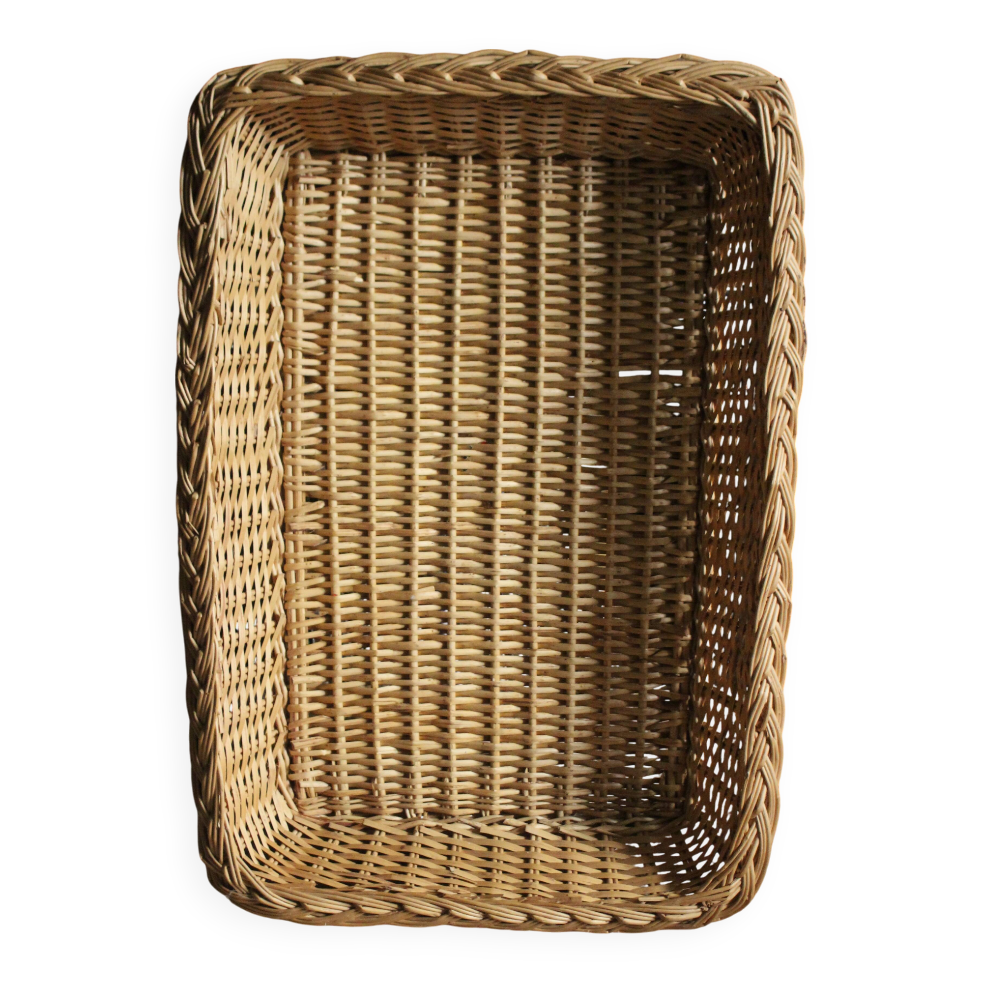 A large vintage rectangular wicker basket
