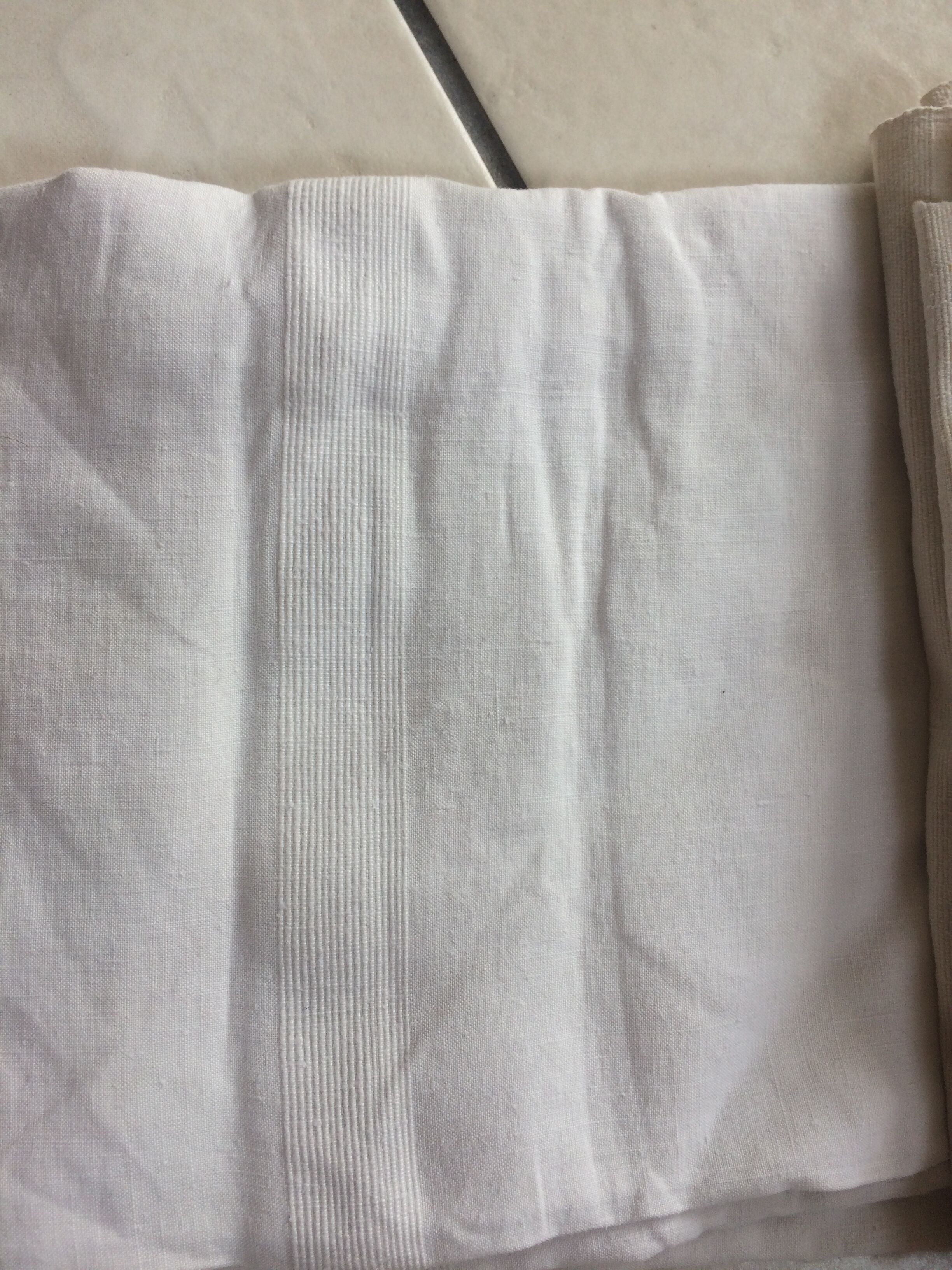 2 old white linen coats