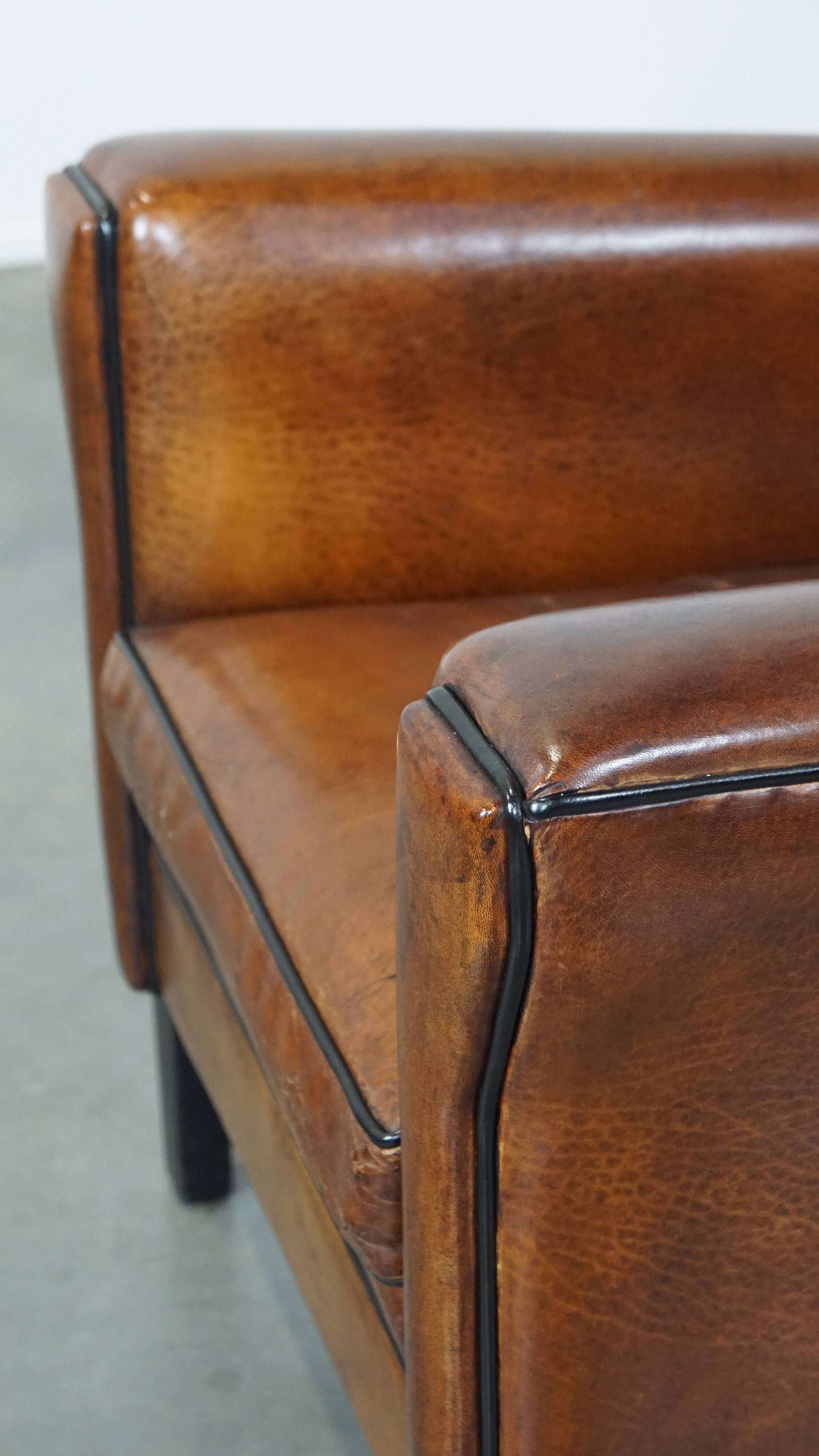 Cognac-colored sheep leather Art Deco design armchair finished with piping