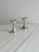Set of 2 vintage silver-plated metal candle holders.