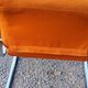 Pair of designer armchairs in orange fabrics and chrome tubes from the 70s