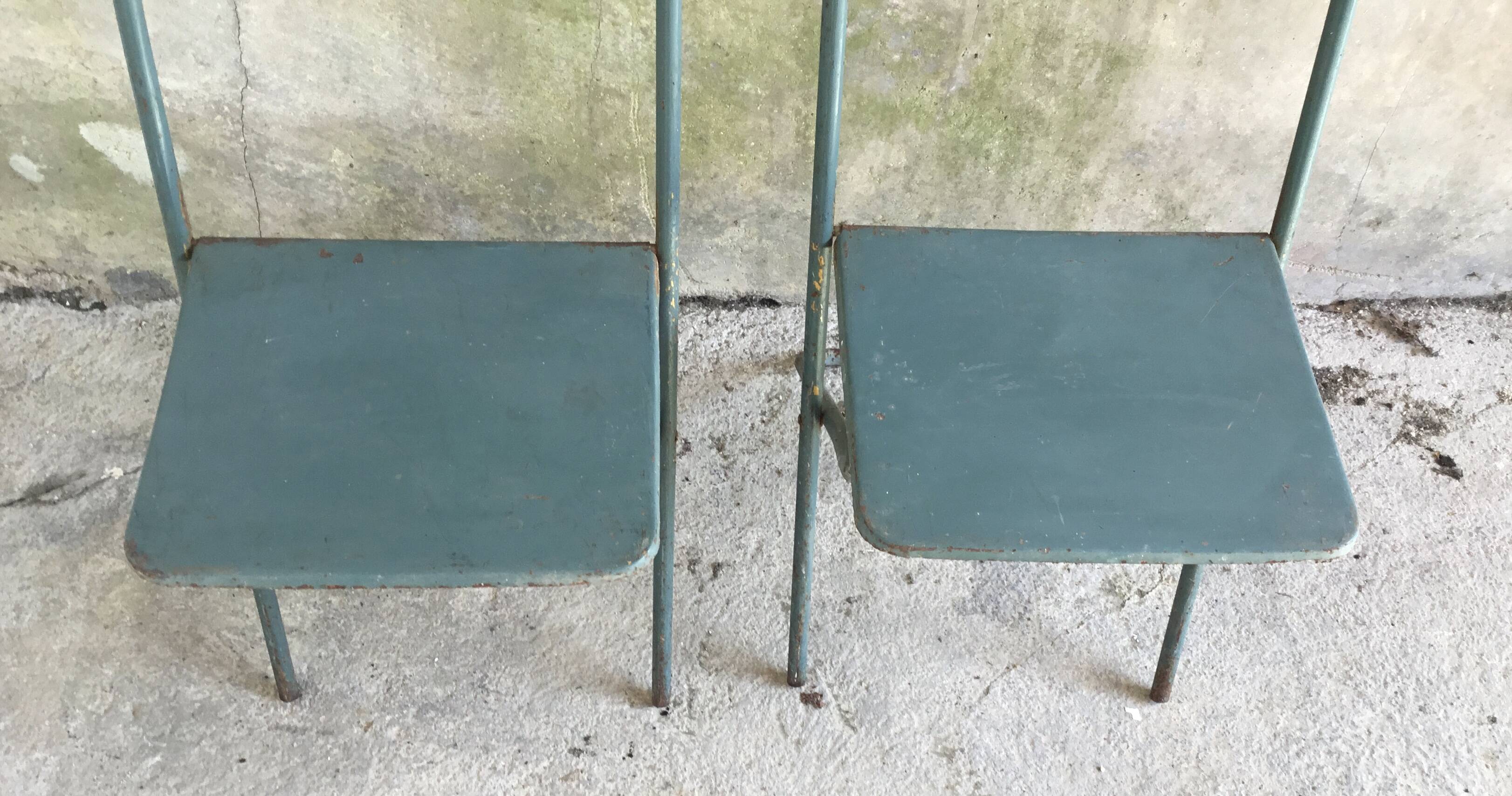 Pair of folding metal chairs, military or industrial, mid-20th century.