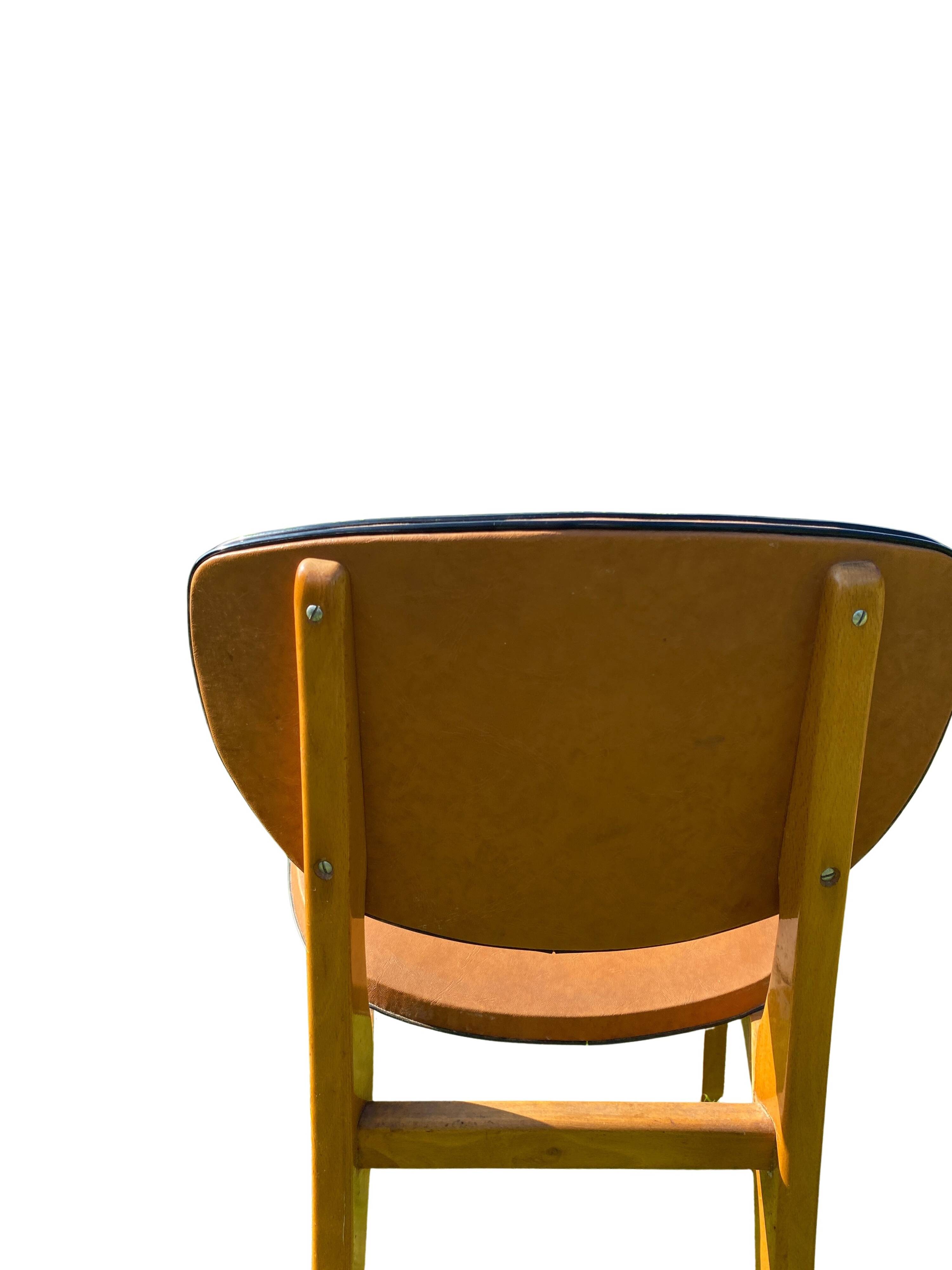 Pair of Scandinavian wood and leather chairs, Circa 1960