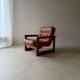 Vintage lounge chair in teak and leather from the 1960s.