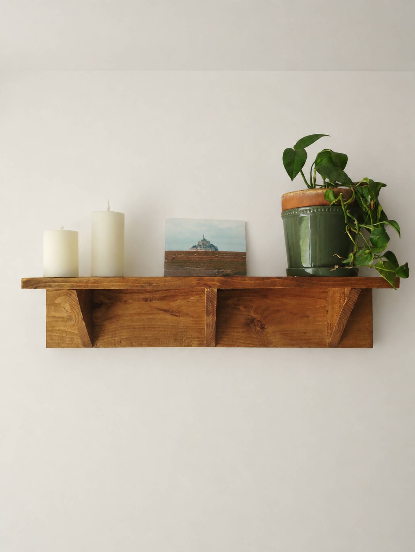 Handcrafted wall shelf in solid fir.