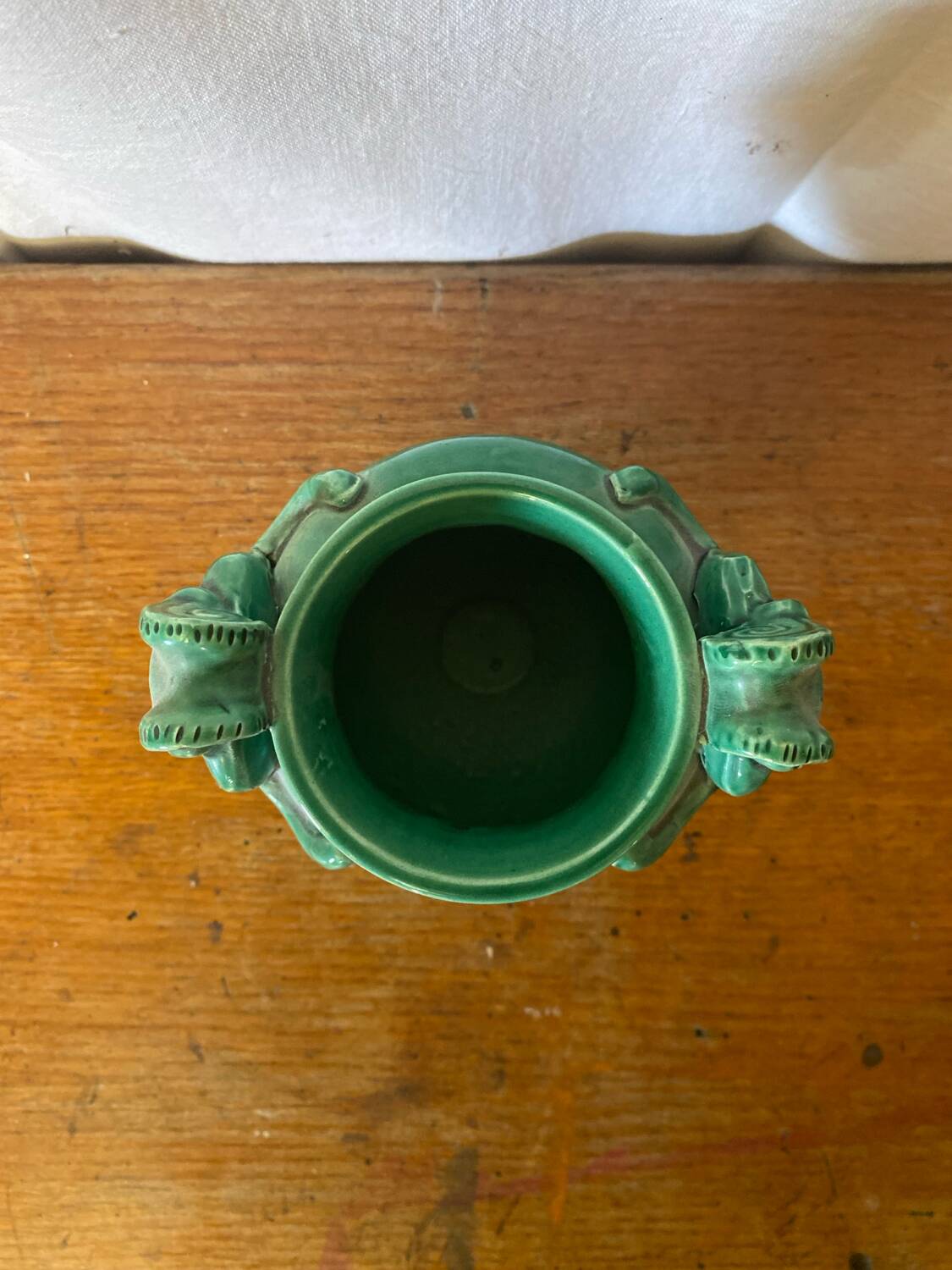 Antique green ceramic vase with handles