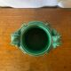 Antique green ceramic vase with handles