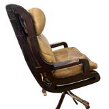 Vintage mahogany and havana leather office chair with wheels from around 1970.