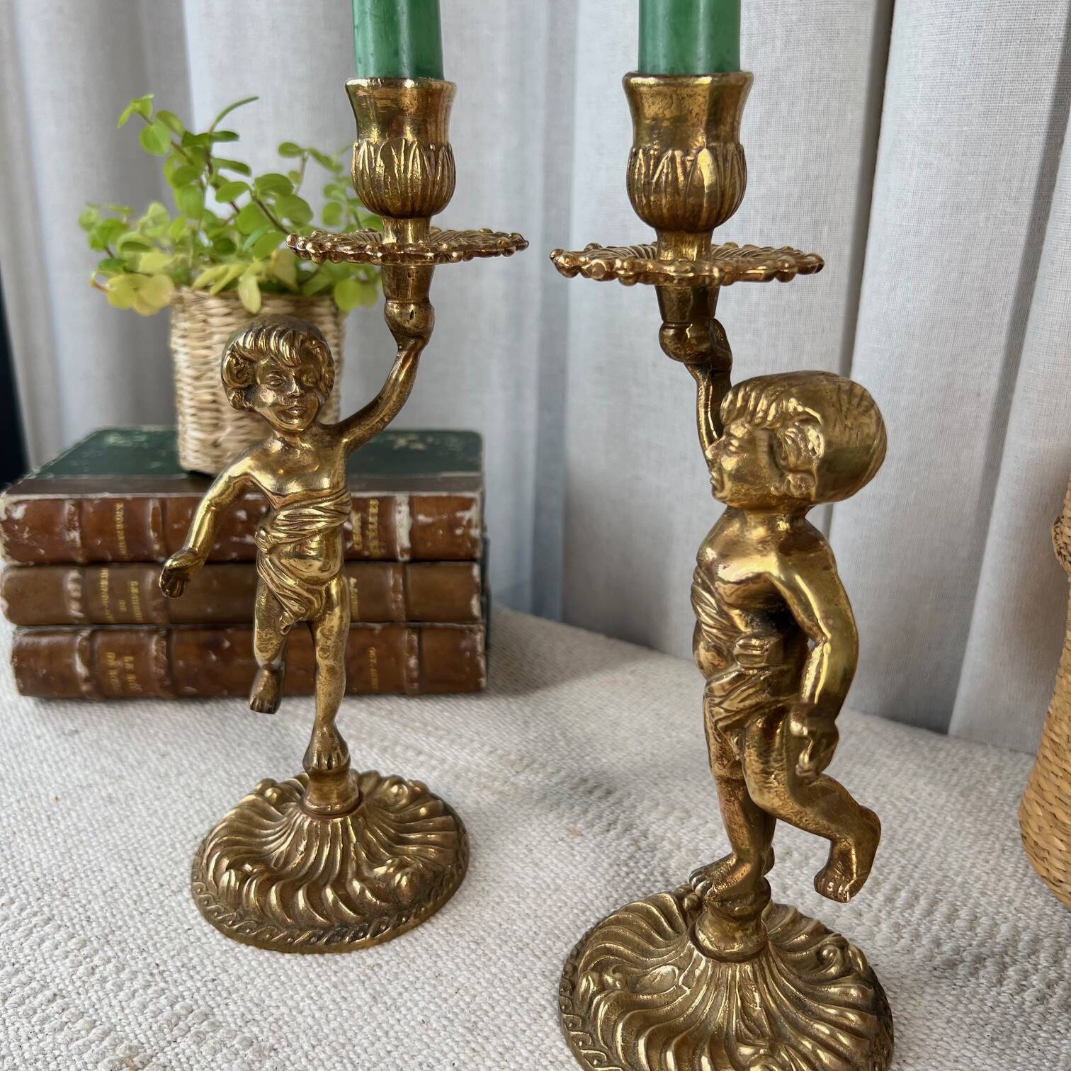 Pair of bronze “Cherubim” candlesticks