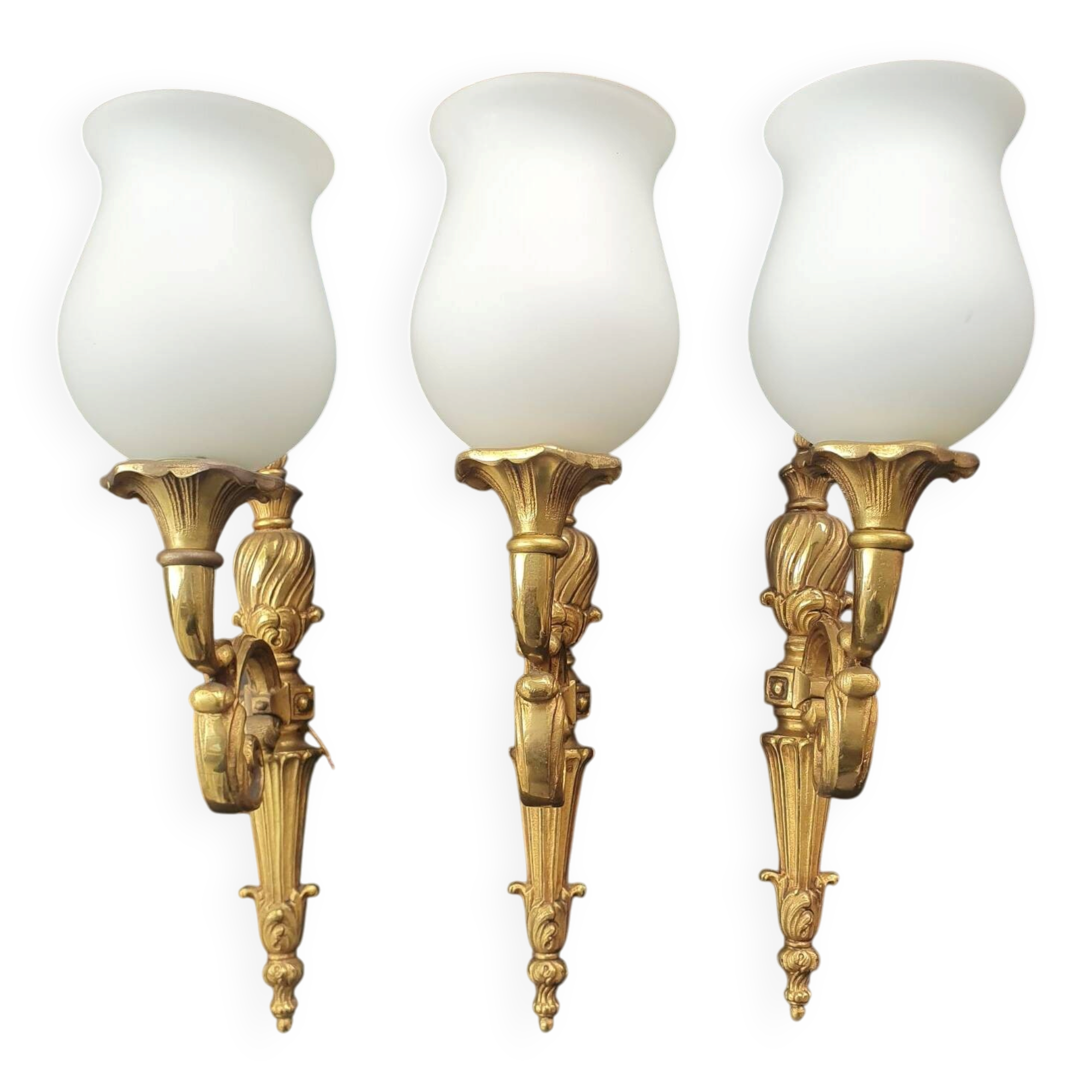 Three large vintage torch wall sconces.