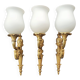 Three large vintage torch wall sconces.