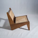 Reclined armchair in canned teak in natural wood