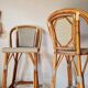 Pair of vintage Gatti bar stools in two-tone rattan and caning.