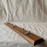 Vintage wooden wall-mounted coat rack with three double hooks
