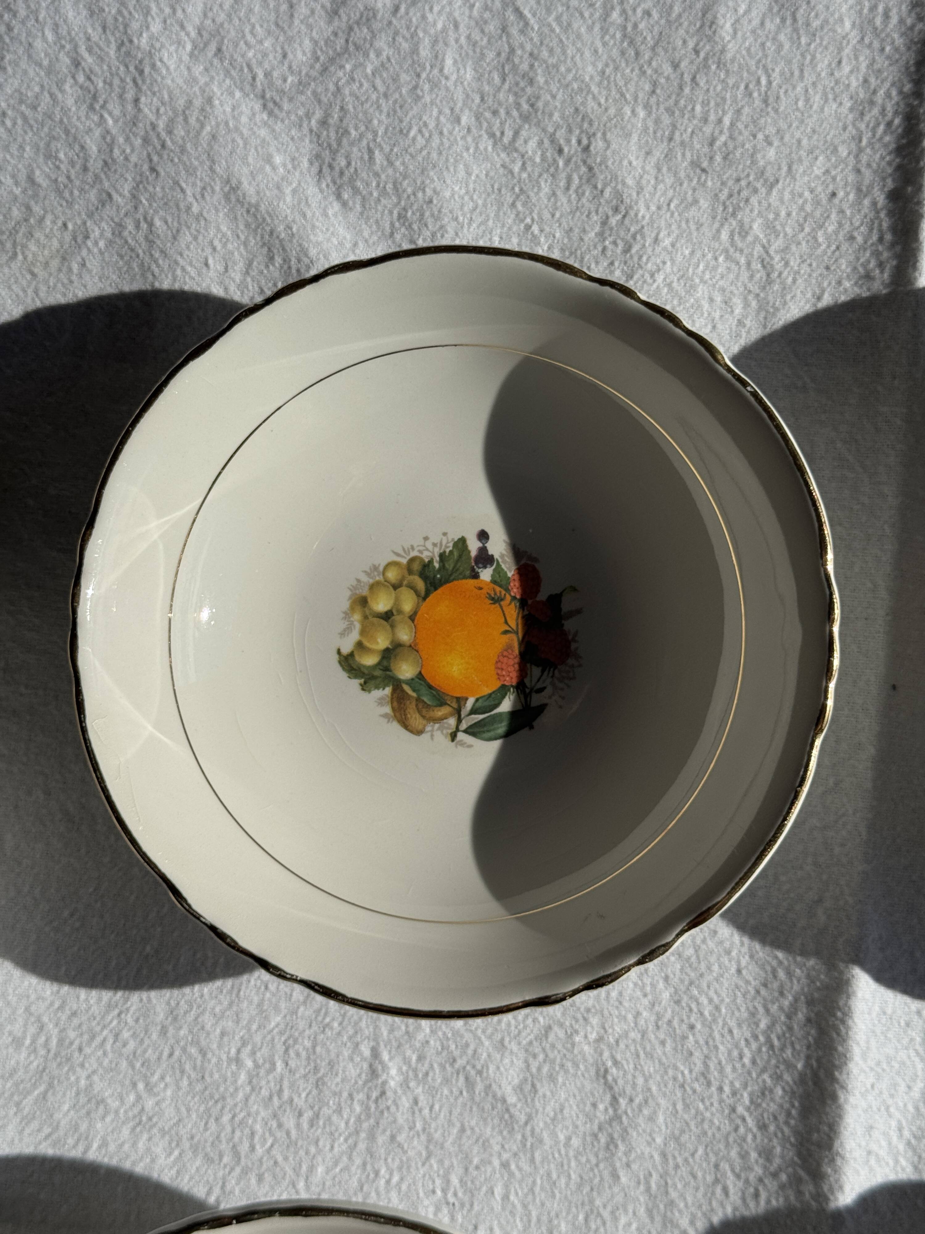 Vintage fruit salad service consisting of a bowl and 7 small dishes.