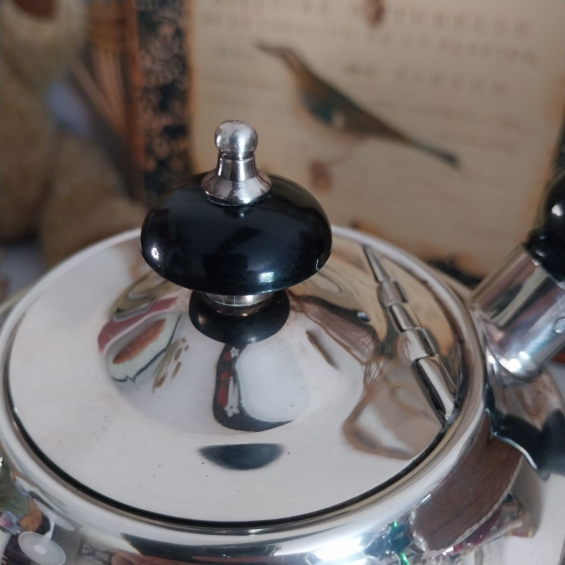 Old English coffee pot in silver-plated metal and Bakelite.