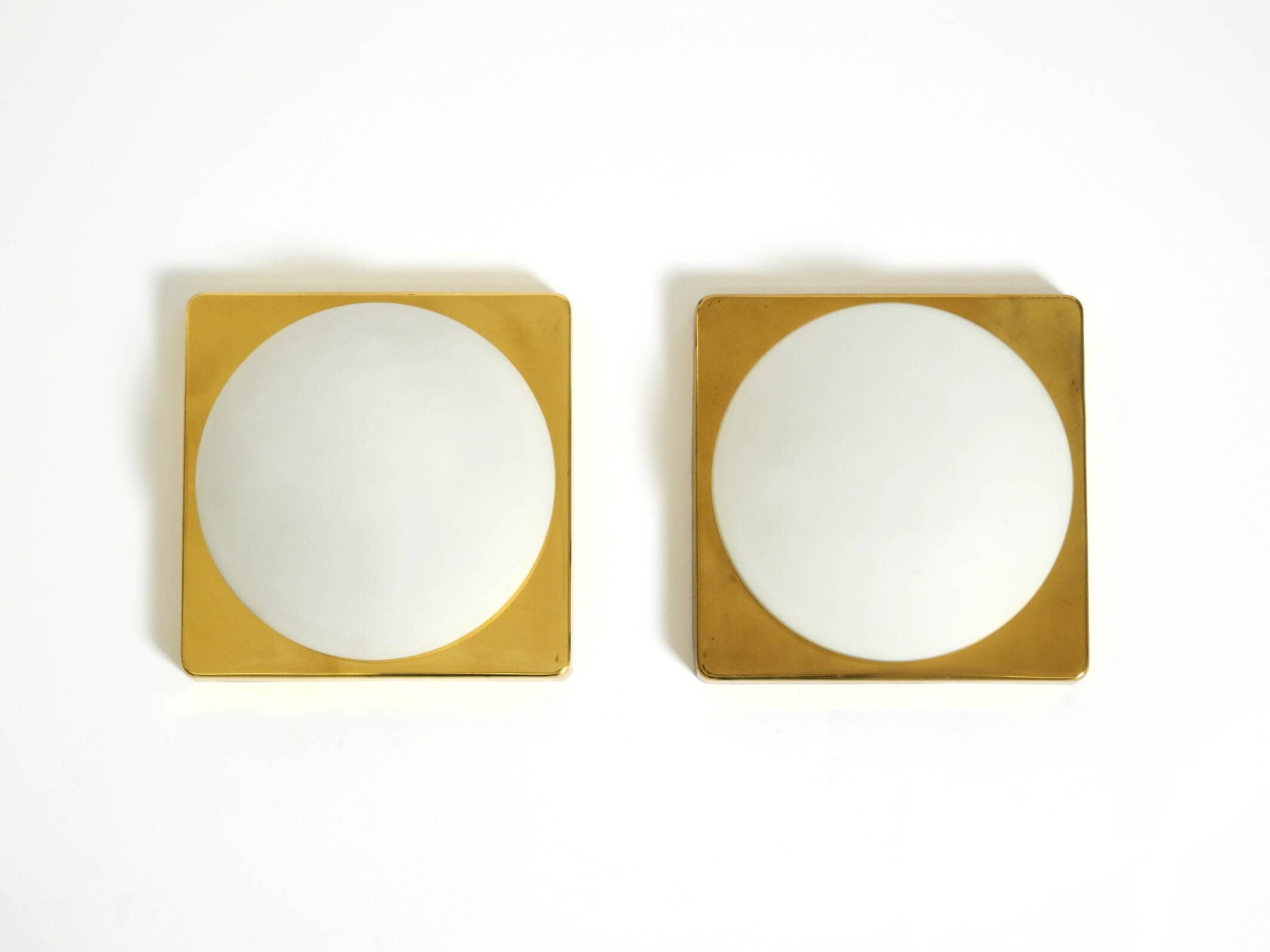 Two 1970s brass wall lamps by Rolf Krüger for Heinz Neuhaus Leuchten