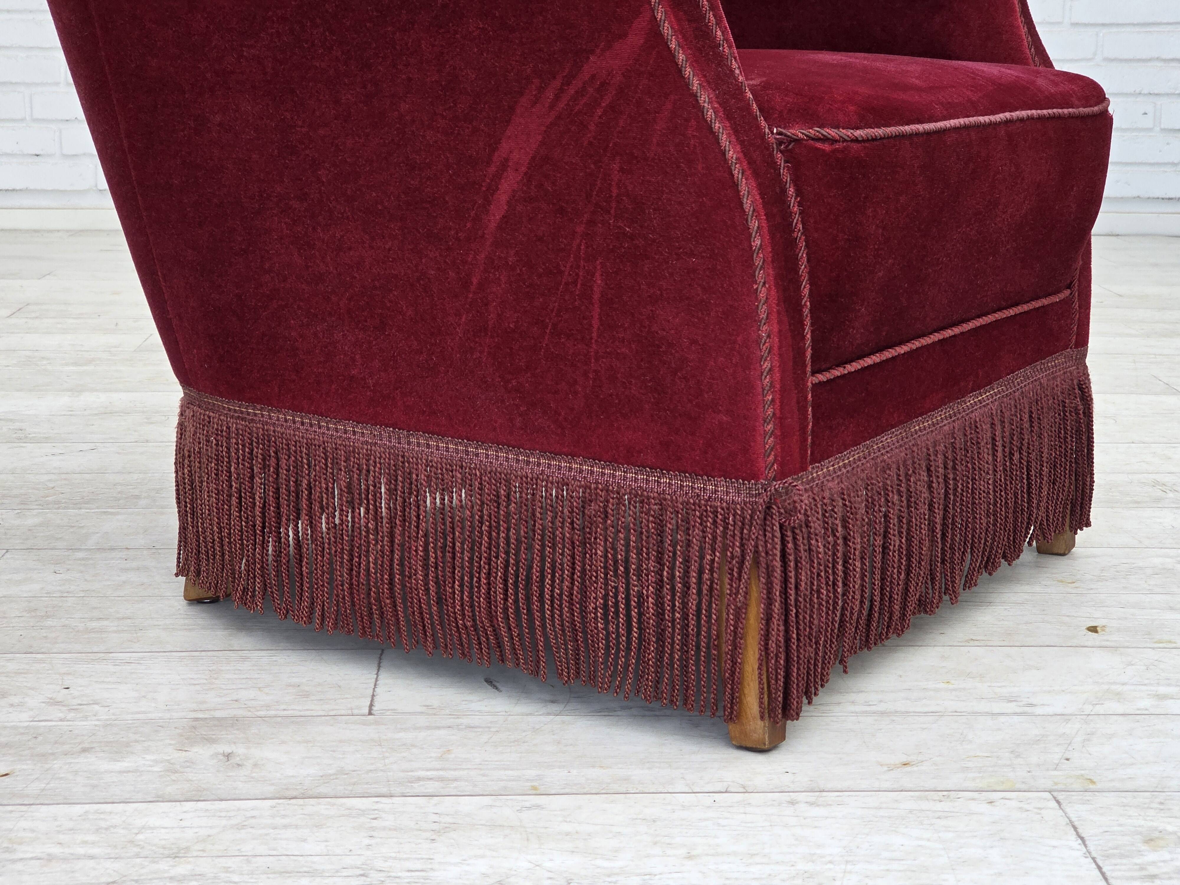 1970s, Danish armchair, cherry-red furniture velour, oak wood legs.