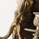 Monobloc gilded bronze wall light, grotesque satyr, two lights.