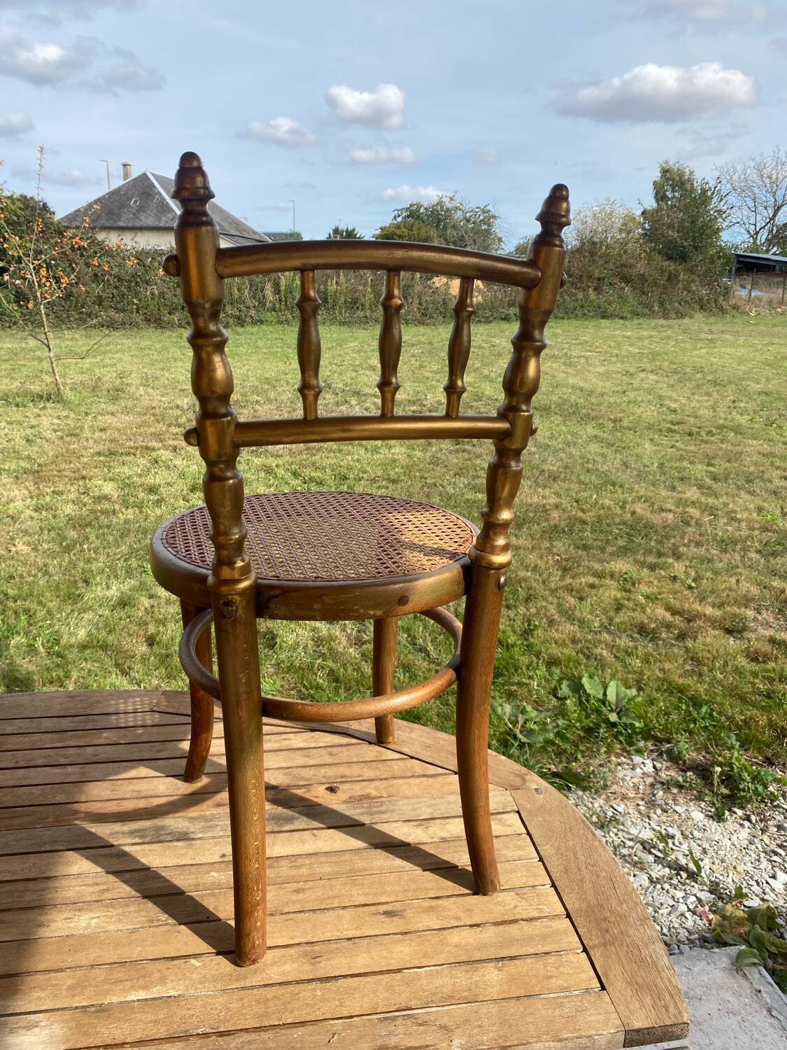 Children's chair in cane and curved wood