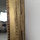 Large gilded wooden mirror in Louis XVI style from the late 19th century.